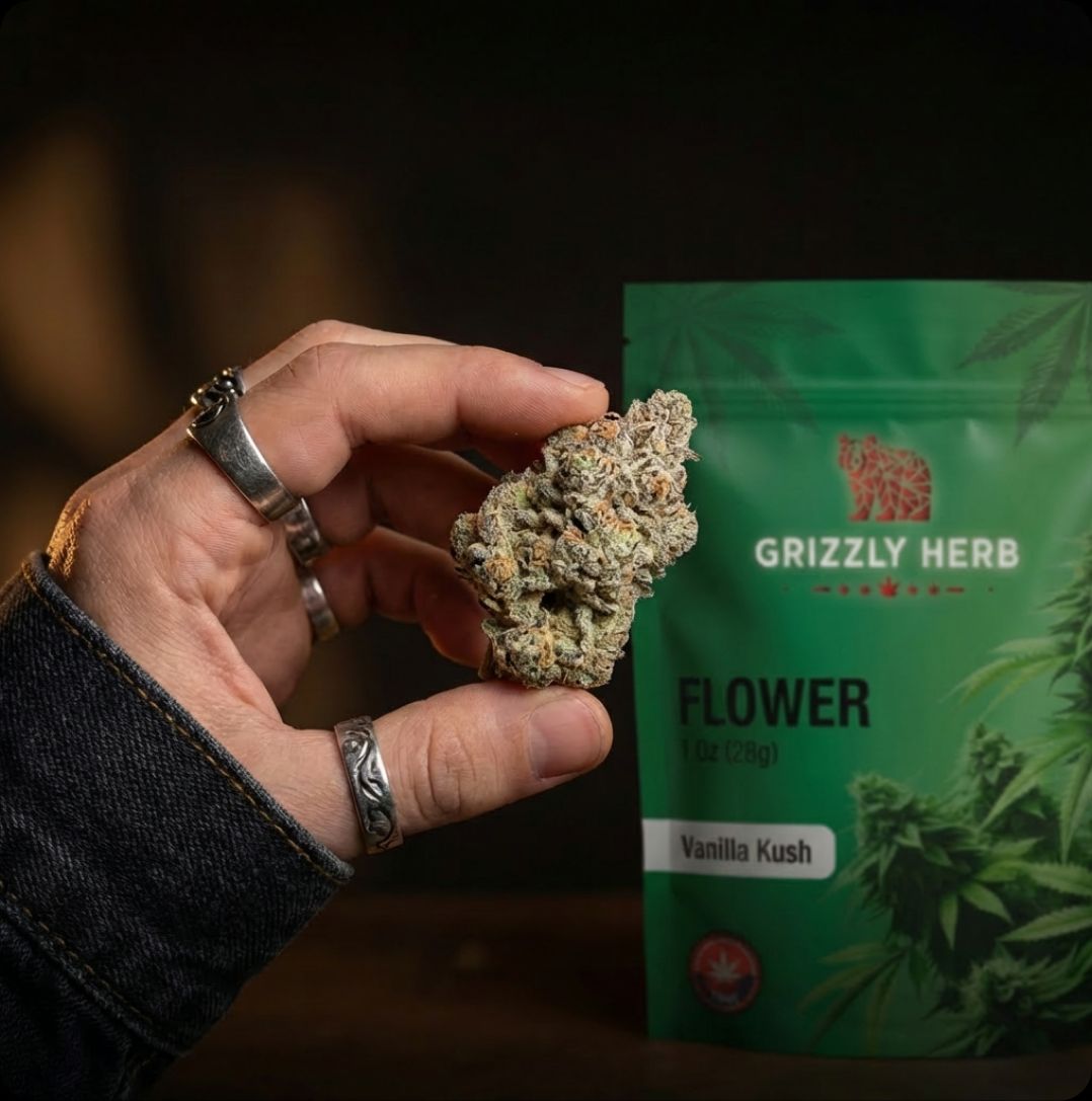 Cannabis buds arranged artistically on a natural wood surface with warm lighting